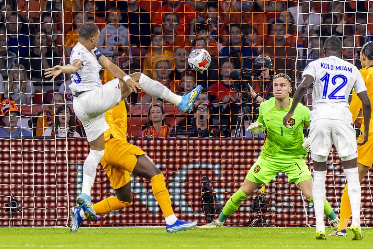Kylian Mbappe pictured volleying the ball to score his 41st international goal for France during a Euro 2024 qualifier against the Netherlands in October 2023